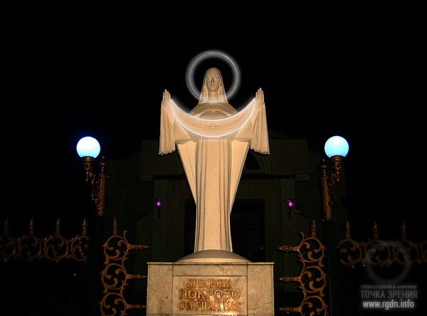 Virgin Mary’s Protecting Veil statue. Stylized AllatRa sign – a circle and a crescent